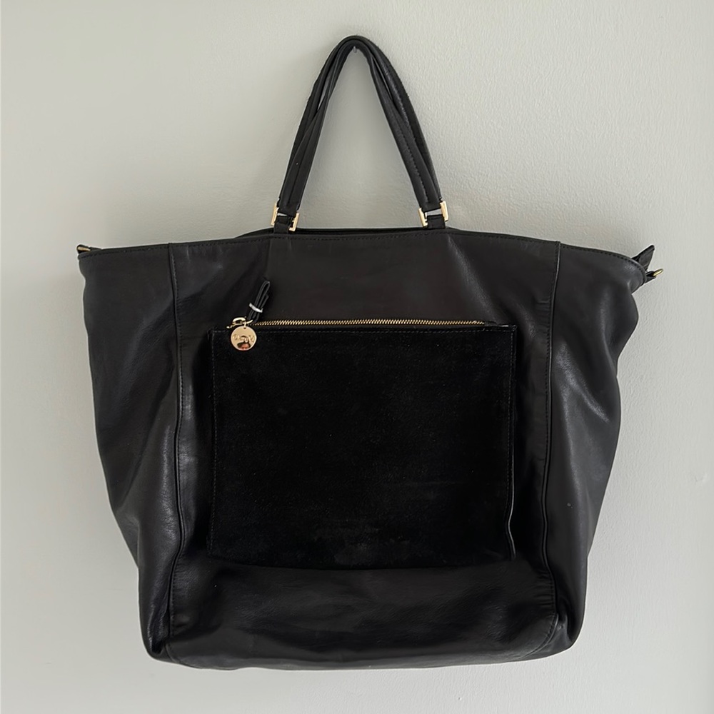 Clare V black leather tote with large suede outer pocket. Blue fabric lining.